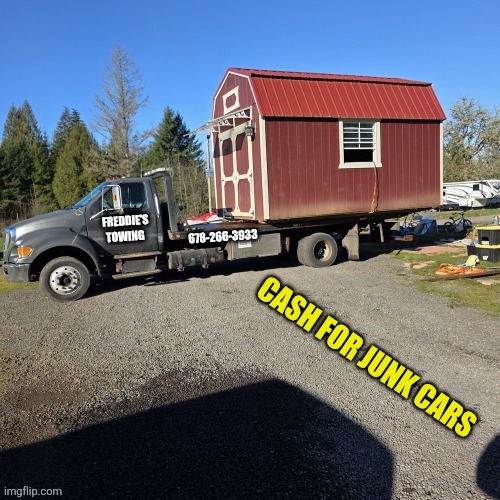Freddie's Towing flatbed truck